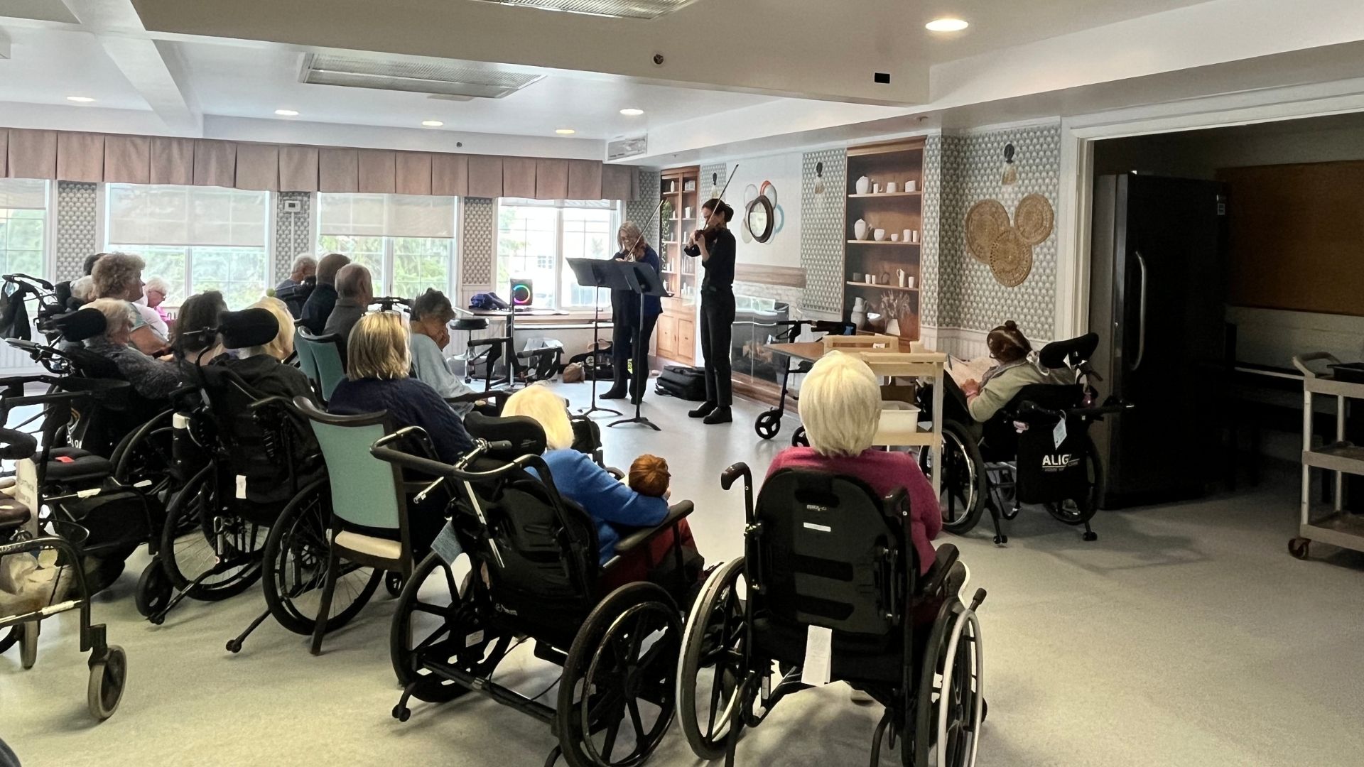 Kingston Symphony musicians performing at a retirement home.